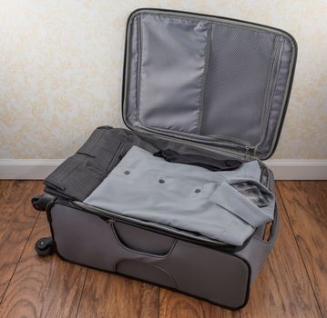Men's packed carry-on suitcase