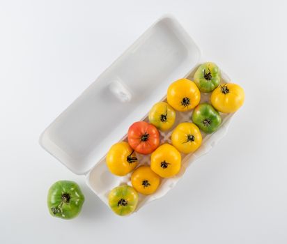Colorful tomato variety in egg carton