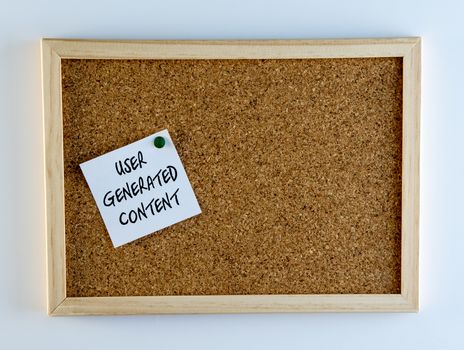 "User Generated Content" pinned on cork bulletin board