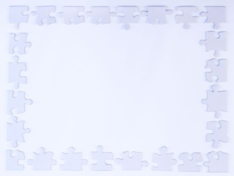 White puzzle piece border on white background