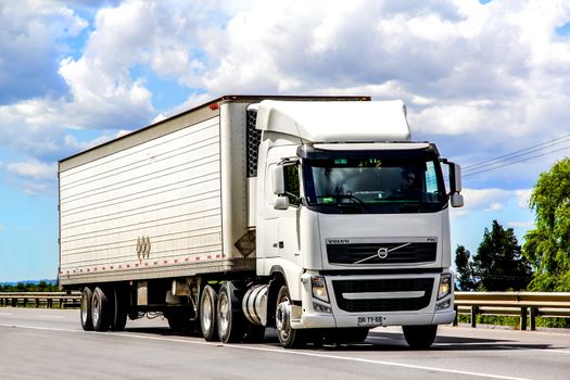 BIO-BIO, CHILE - NOVEMBER 23, 2015: Semi-trailer truck Volvo FH12.480 at the interurban freeway.