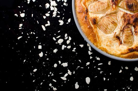 Sweet tasty pear pie isolated on black background