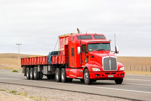 ATACAMA, CHILE - NOVEMBER 14, 2015: Semi-trailer truck Kenworth T660 at the interurban freeway.