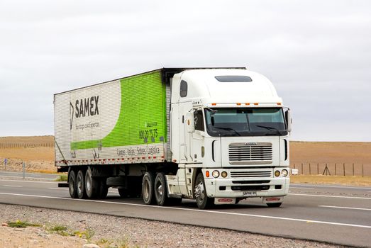 ATACAMA, CHILE - NOVEMBER 14, 2015: Semi-trailer truck Freightliner Argosy at the interurban freeway.