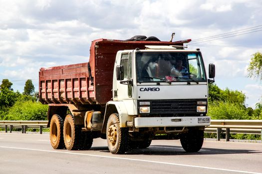 BIO-BIO, CHILE - NOVEMBER 23, 2015: Dump truck Ford Cargo at the interurban freeway.