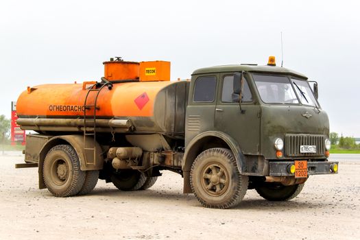 TATARSTAN, RUSSIA - MAY 20, 2013: Old soviet cistern truck MAZ 500 near the interurban freeway.