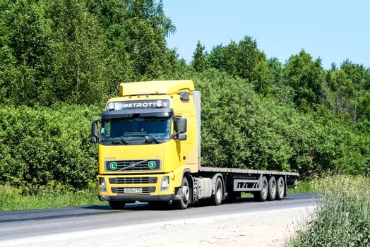 CHELYABINSK REGION, RUSSIA - JUNE 22, 2008: Semi-trailer truck Volvo FH12 at the interurban freeway.