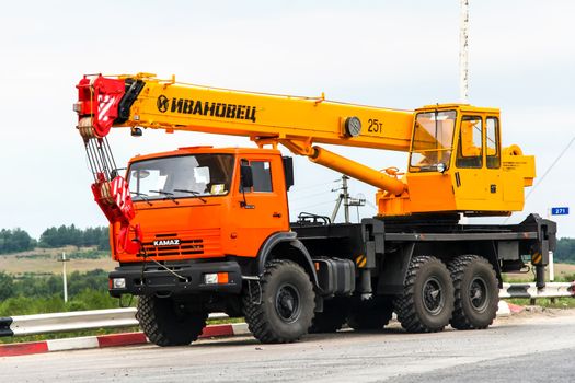 CHELYABINSK REGION, RUSSIA - JULY 21, 2012: Off-road mobile crane Kamaz 43118 at the interurban road.