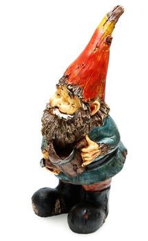 Adorable wooden garden gnome with watering can Standing. Isolated over white.