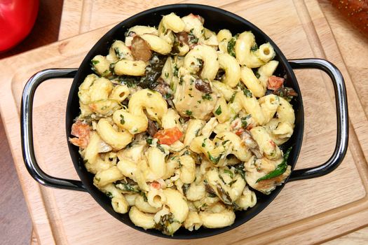 Pot of Italian Tuscan Chicken and Noodles on table.