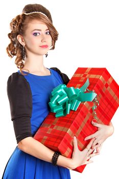 Portrait of a beautiful young woman holding a big gift isolated over white background