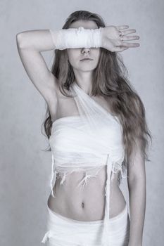 Young woman with a bandage dressings on her body