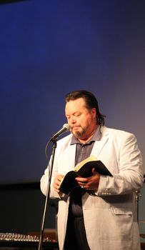 CASPER, WY__CIRCA JUNE 29, 2013__Minister Blaine Bowman preaching a sermon in Casper, Wyoming.