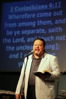 CASPER, WY__CIRCA JUNE 29, 2013__Minister Blaine Bowman preaching a sermon in Casper, Wyoming.