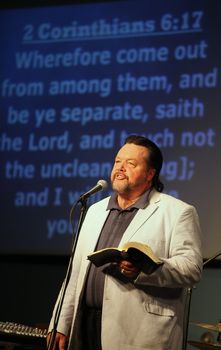CASPER, WY__CIRCA JUNE 29, 2013__Minister Blaine Bowman preaching a sermon in Casper, Wyoming.