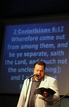 CASPER, WY__CIRCA JUNE 29, 2013__Minister Blaine Bowman preaching a sermon in Casper, Wyoming.