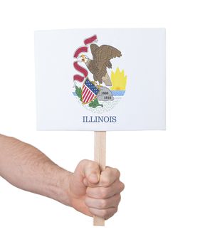 Hand holding small card, isolated on white - Flag of Illinois