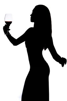 Silhouette of a woman holding the wineglass