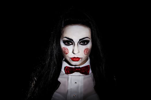 Woman with a Saw film cosplay makeup over black background