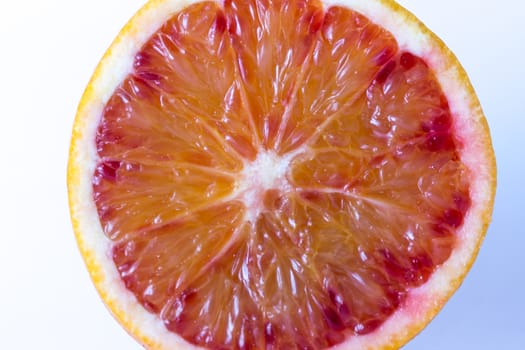 Fresh juicy slice of orange on white background