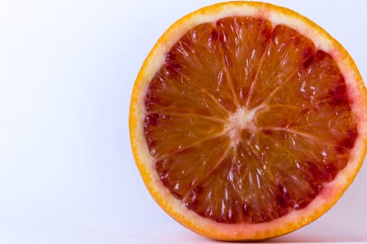 Fresh juicy slice of orange on white background