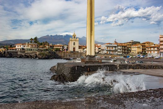 View of Sea port in sicily whit volcano Etna in background