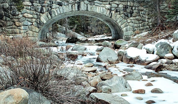 river with snow in the forest at Sequoia national park, USA in winter