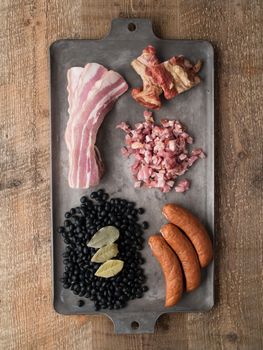 close up of rustic brazilian feijoada pork and black bean stew ingredient