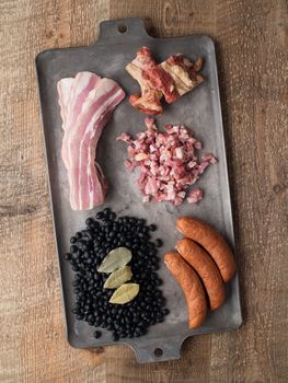 close up of rustic brazilian feijoada pork and black bean stew ingredient