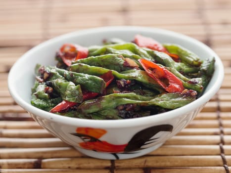 close up of rustic chinese long snake bean stir fry