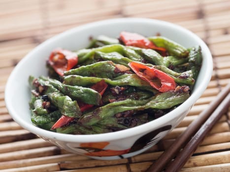 close up of rustic chinese long snake bean stir fry