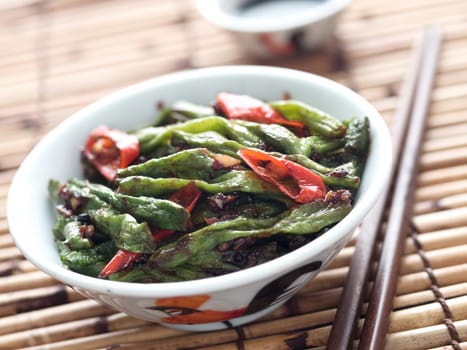 close up of rustic chinese long snake bean stir fry