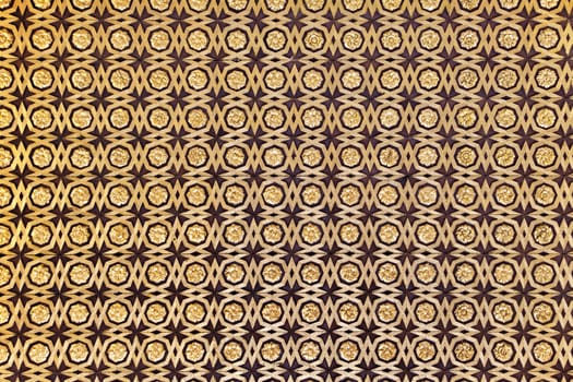 Gild wallpaper in Alcazar palace in Seville, Spain