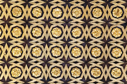 Gild wallpaper in Alcazar palace in Seville, Spain