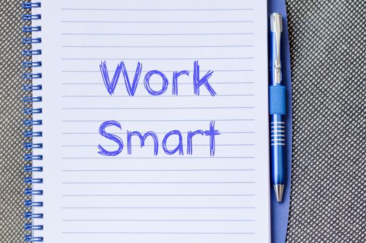 Work smart text concept write on notebook with pen