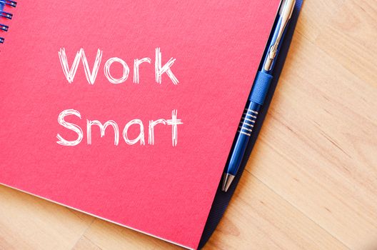 Work smart text concept write on notebook with pen