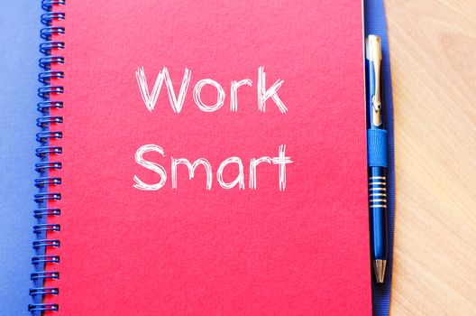 Work smart text concept write on notebook with pen