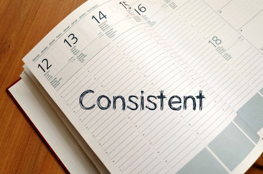 Consistent text concept write on notebook with pen