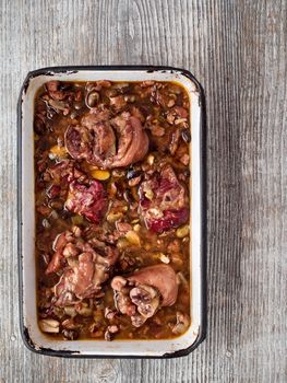 close up of rustic brazilian feijoada pork with black bean stew