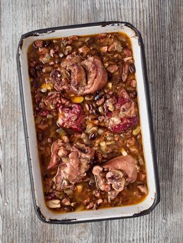 close up of rustic brazilian feijoada pork with black bean stew