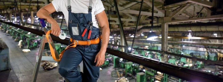 Worker with instruments at industrial factory