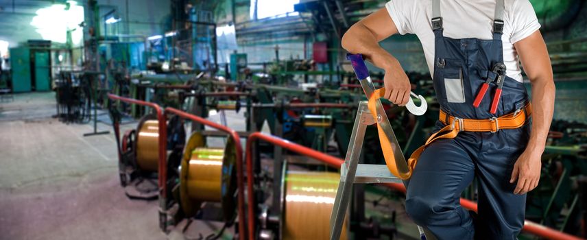 Worker with instruments at industrial factory