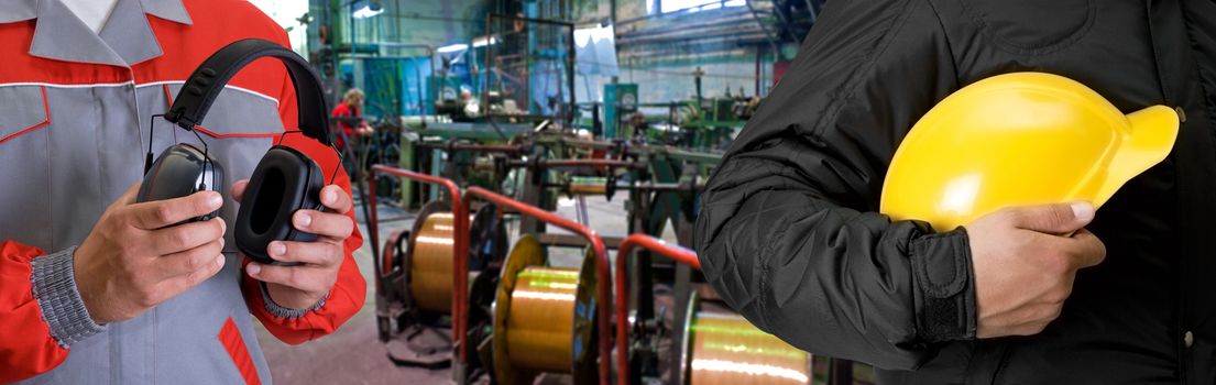 Workers with safety uniform at industrial factory