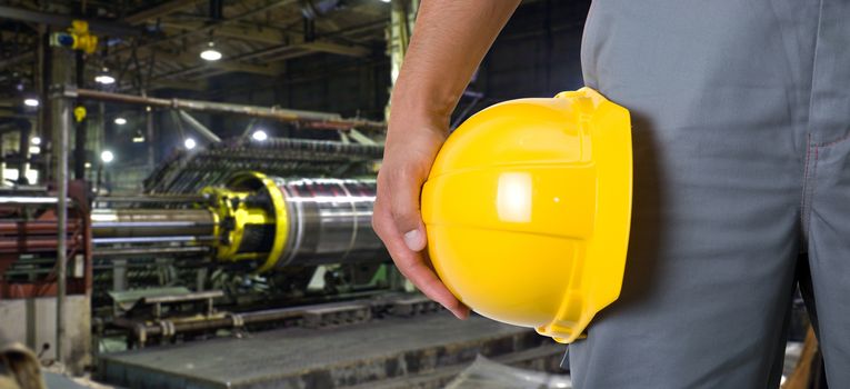 Worker with safety helmet at industrial factory