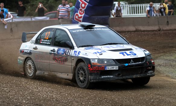KOCAELI, TURKEY - AUGUST 23, 2015: Mustafa Cakal with Mitsubishi Lancer Evo IX in Kocaeli Rally 2015
