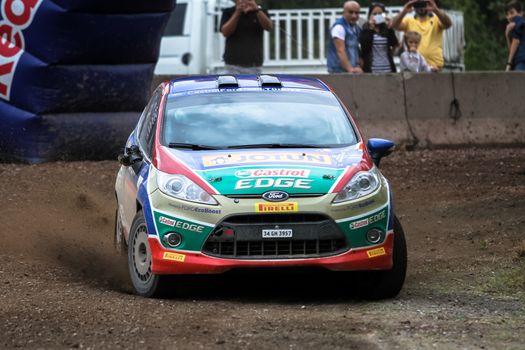 KOCAELI, TURKEY - AUGUST 23, 2015: Umit Can Ozdemir with Ford Fiesta R2 of Castrol Ford Team Turkiye in Kocaeli Rally 2015