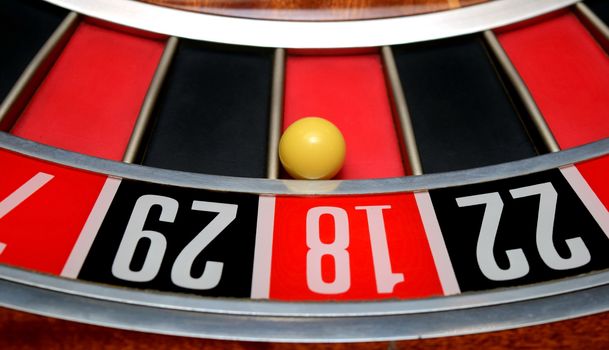 white ball in winning number eighteen at roulette wheel