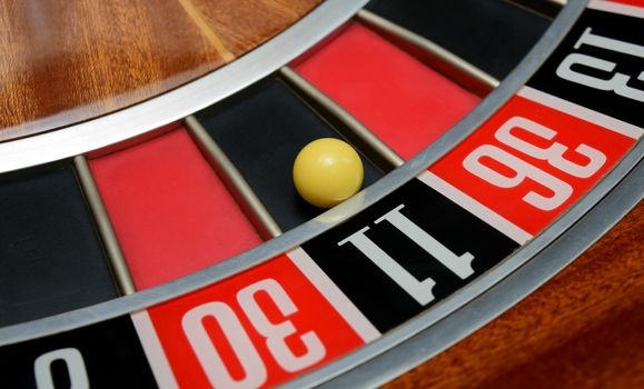 ball in winning number eleven at roulette wheel