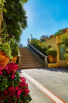 Brown concrete stair in city garden. The sun is shining into the lens