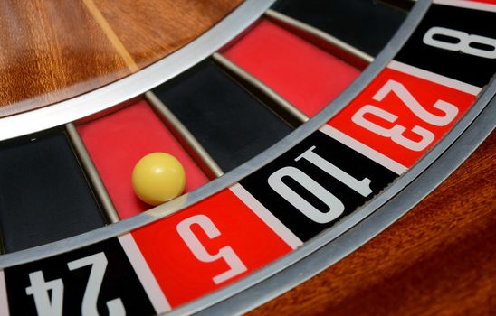 ball in winning number five at roulette wheel